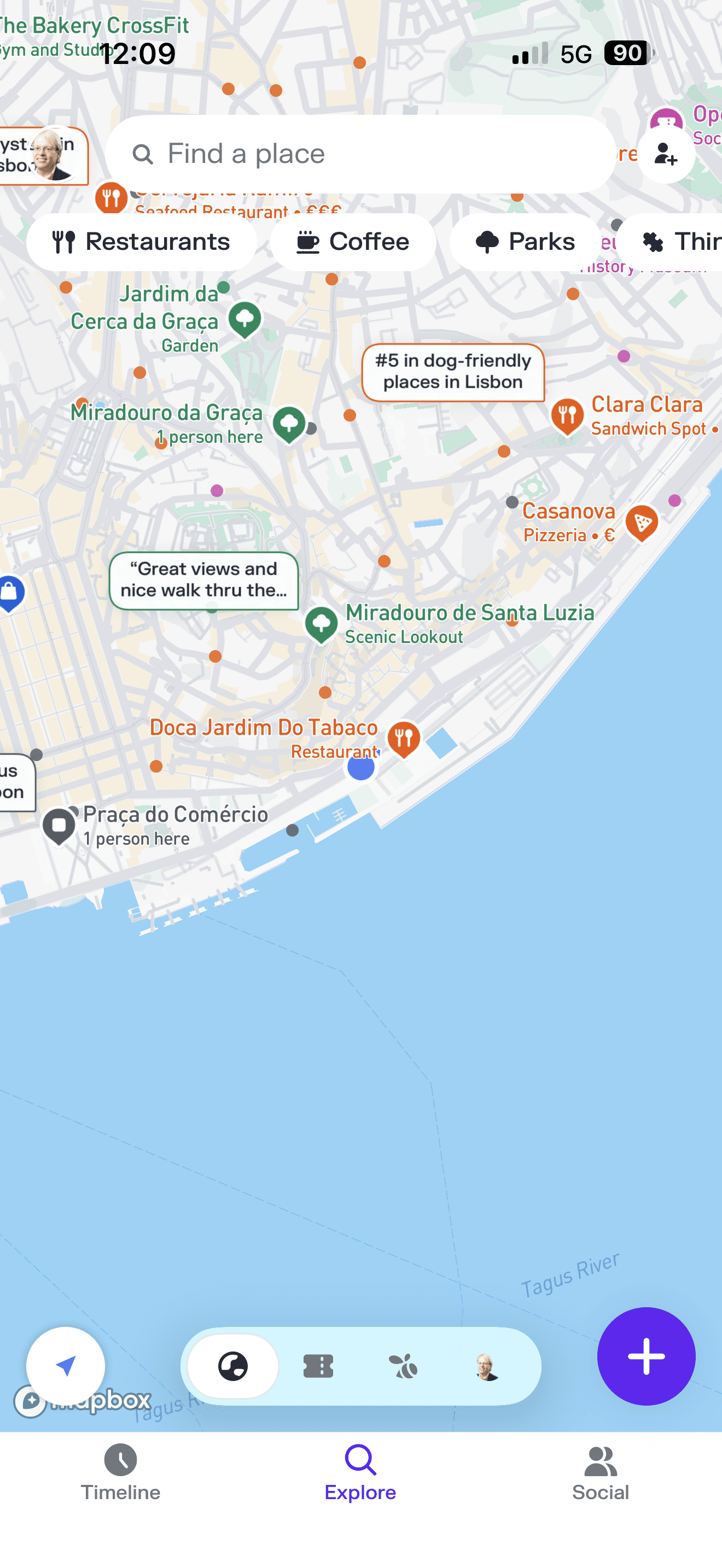 Mapbox travel app screenshot showing Lisbon's historic waterfront along the Tagus River with pinned restaurants, scenic looko
